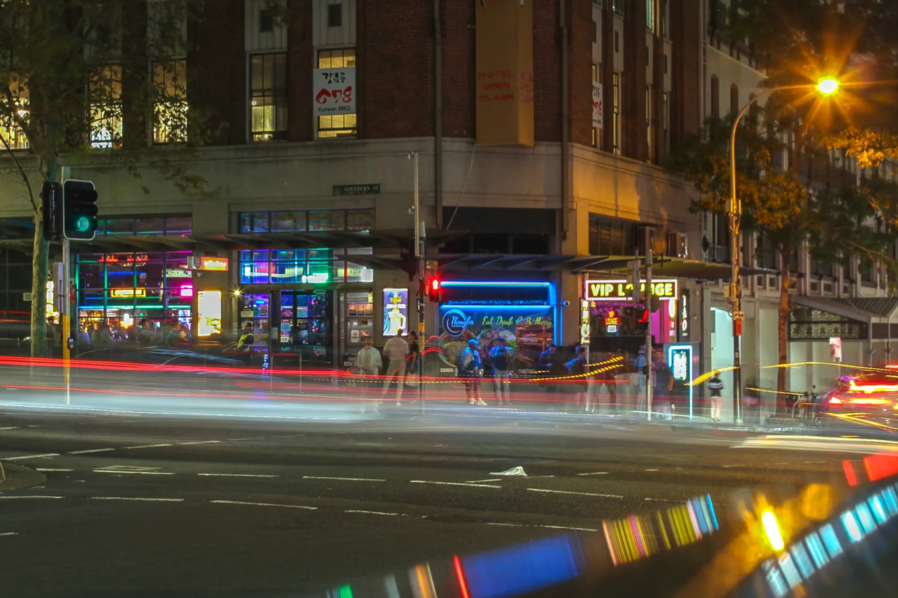 Leading Lines using a slow shutter speed (motion blur with/ of obvious depicted subject matter) of zooming cars