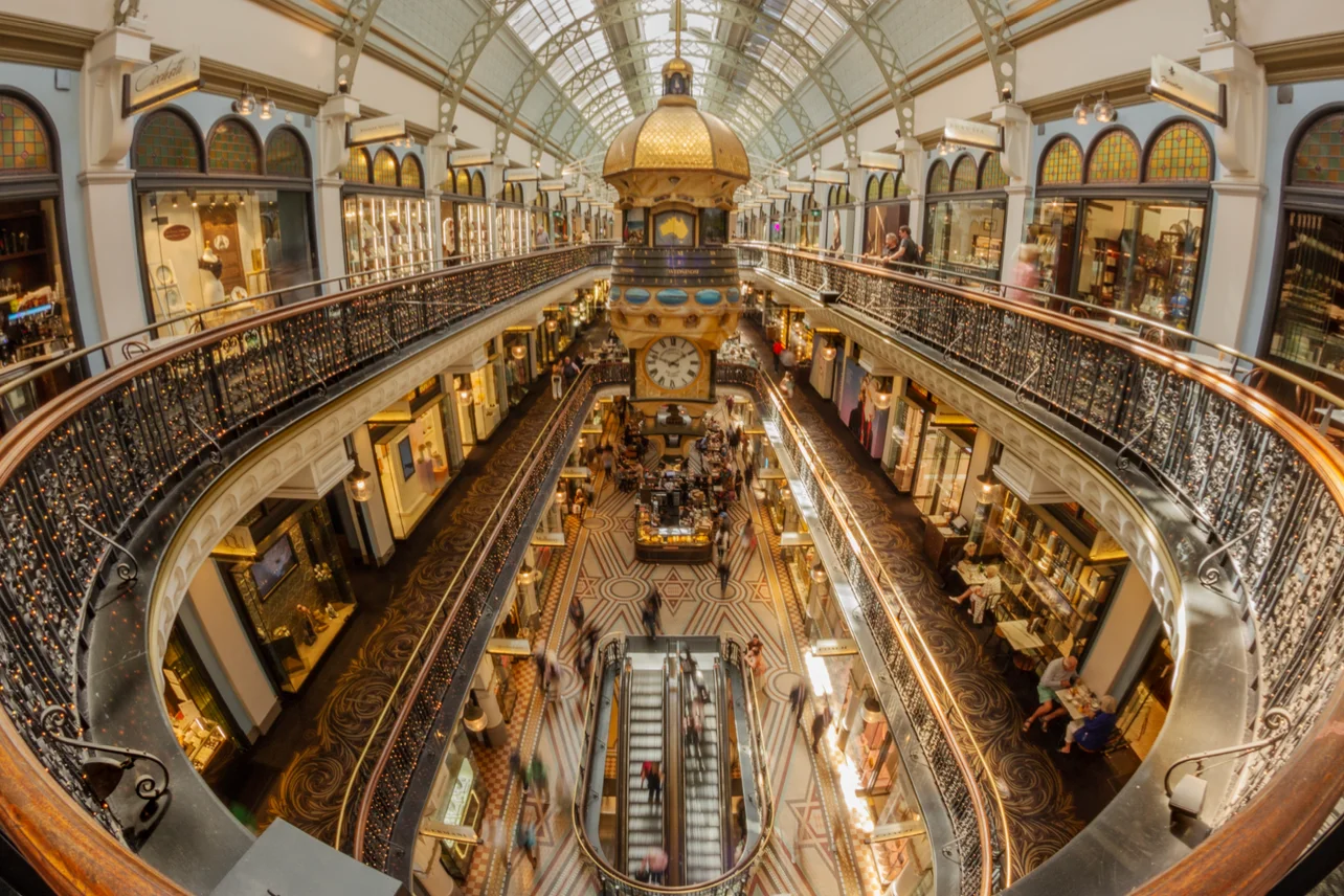 Edge of Frame using a slow shutter speed (motion blur with/ of obvious depicted subject matter) of Queen Victoria Building